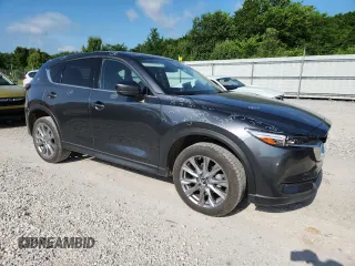 2020 Mazda CX-5 Grand Touring z VIN JM3KFADM2L0803589, wystawiony jako Copart lot #61916825 z przebiegiem 63 663 mil mil oraz Szkoda całkowita • Salvage title. Historia ofert i sprzedaży dostępna na DreamBid. Obrazek 4.