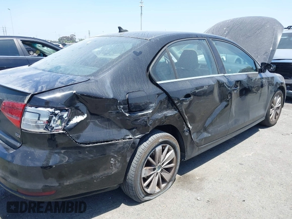 2015 Volkswagen Jetta SE z VIN 3VWD07AJ1FM284890, wystawiony jako IAAI lot #42328592 z przebiegiem 92 880 mil mil oraz . Historia ofert i sprzedaży dostępna na DreamBid. Obrazek 6.