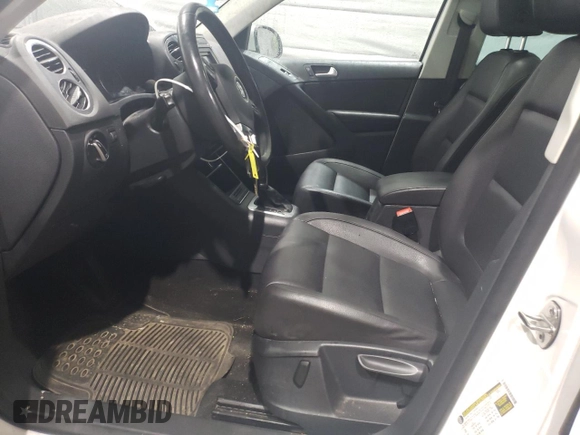 2013 Volkswagen Tiguan SEL with VIN WVGBV3AX2DW058147, listed as a Copart auction lot 47110285 with 156,145 mi miles and Salvage Title. Bid and sale history available at DreamBid. Image 7.