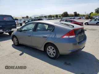 2010 Honda Insight EX with VIN JHMZE2H7XAS021268, listed as a Copart auction lot 54179245 with 211,561 mi miles and Salvage Title. Bid and sale history available at DreamBid. Image 2.