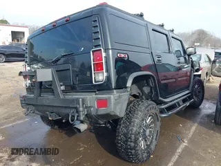 2006 Hummer H2 with VIN 5GRGN23U06H113353, listed as a IAAI auction lot 41476649 with 165,370 mi miles. Bid and sale history available at carsss.com. Image 4.