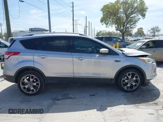 2014 Ford Escape Titanium с VIN 1FMCU0J9XEUB93591, выставлен на аукционе IAAI как лот 41721869 с пробегом 98 859 миль миль и . История ставок и продаж доступна на DreamBid. Изображение 13.