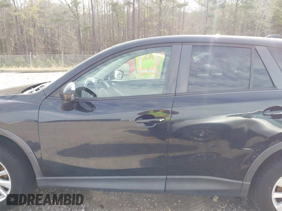 2014 Mazda CX-5 Touring with VIN JM3KE2CY9E0333951, listed as a IAAI auction lot 41825345 with 124,684 mi miles. Bid and sale history available at carsss.com. Image 14.