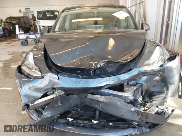2021 Tesla Model Y Long Range with VIN 5YJYGDEE2MF087871, listed as a IAAI auction lot 41370004 with 85,757 mi miles. Bid and sale history available at carsss.com. Image 12.
