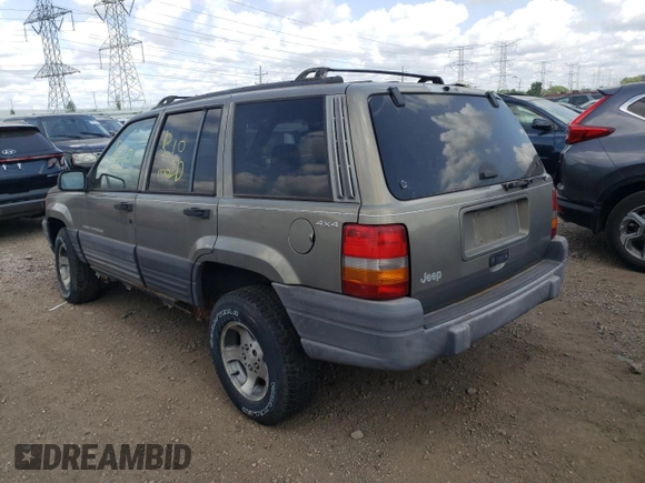 1997 Jeep Grand Cherokee Laredo z VIN 1J4GZ58S4VC502596, wystawiony jako Copart lot #88255865 z przebiegiem Nie podano mil oraz Nie do naprawy • Non repairable. Historia ofert i sprzedaży dostępna na DreamBid. Obrazek 2.