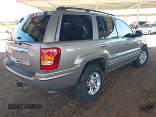 2000 Jeep Grand Cherokee Limited z VIN 1J4GW58N1YC206992, wystawiony jako IAAI lot #42057236 z przebiegiem 183 986 mil mil oraz . Historia ofert i sprzedaży dostępna na DreamBid. Obrazek 4.