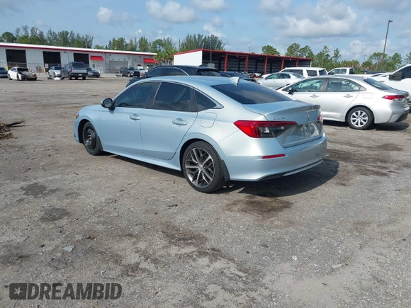 2023 Honda Civic Touring with VIN 2HGFE1F91PH305053, listed as a IAAI auction lot 42378311 with 41,576 mi miles and . Bid and sale history available at DreamBid. Image 3.