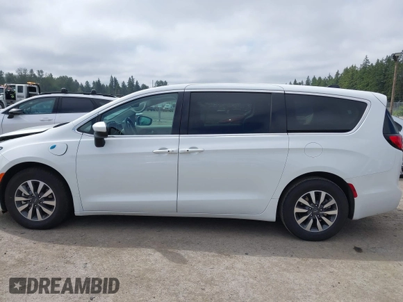 2023 Chrysler Pacifica Hybrid Touring L with VIN 2C4RC1L77PR541513, listed as a IAAI auction lot 42433421 with 53,979 mi miles and . Bid and sale history available at DreamBid. Image 15.