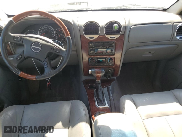 2006 GMC Envoy Denali with VIN 1GKET63M762190296, listed as a Copart auction lot 46691595 with 128,985 mi miles and Salvage Title. Bid and sale history available at carsss.com. Image 8.