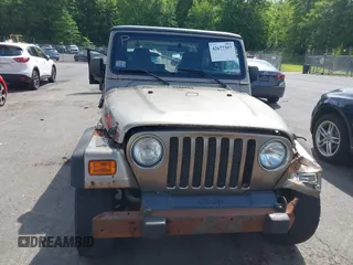 2005 Jeep Wrangler Sport with VIN 1J4FA49SX5P317120, listed as a IAAI auction lot 42677397 with 71,403 mi miles and . Bid and sale history available at DreamBid. Image 12.