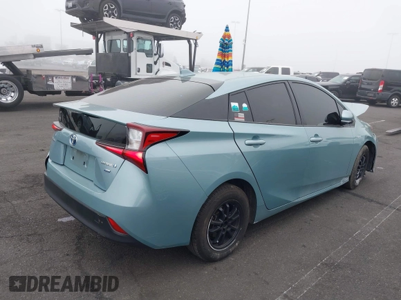 2022 Toyota Prius L Eco with VIN JTDKAMFU9N3186859, listed as a IAAI auction lot 41486941 with 122,665 mi miles and . Bid and sale history available at DreamBid. Image 4.