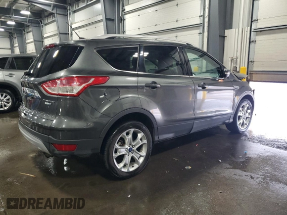 2015 Ford Escape Titanium with VIN 1FMCU9J90FUA26808, listed as a Copart auction lot 54449805 with 184,576 mi miles and Salvage title. Bid and sale history available at DreamBid. Image 3.
