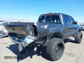 2014 Toyota Tacoma PreRunner with VIN 3TMJU4GN3EM165840, listed as a IAAI auction lot 41666871 with 150,333 mi miles and . Bid and sale history available at DreamBid. Image 4.