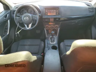2015 Mazda CX-5 Touring with VIN JM3KE2CY0F0439125, listed as a Copart auction lot 43324945 with 210,404 mi miles and Clean Title. Bid and sale history available at DreamBid. Image 8.