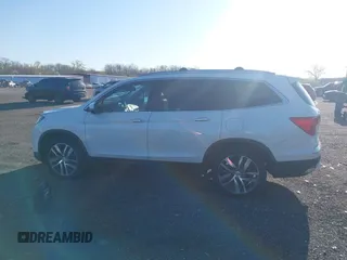 2017 Honda Pilot Elite with VIN 5FNYF6H00HB032386, listed as a IAAI auction lot 41976702 with 153,251 mi miles and . Bid and sale history available at DreamBid. Image 14.