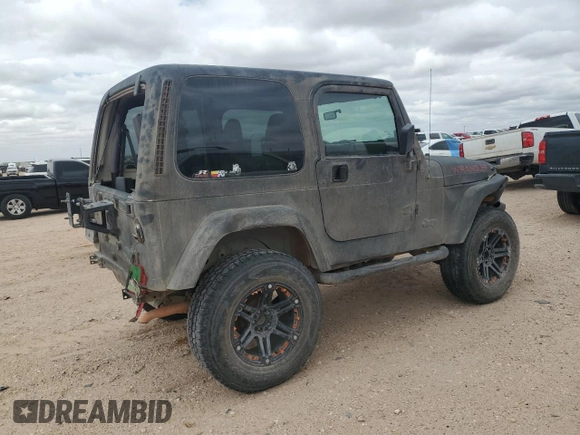 1998 Jeep Wrangler Sahara with VIN 1J4FY49S0WP749826, listed as a Copart auction lot 55174205 with 203,574 mi miles and Salvage title. Bid and sale history available at DreamBid. Image 3.