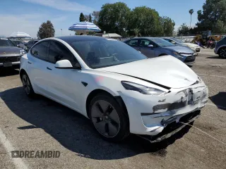 2023 Tesla Model 3 with VIN 5YJ3E1EA9PF401418, listed as a Copart auction lot 50597015 with 79,673 mi miles and Salvage Title. Bid and sale history available at DreamBid. Image 4.