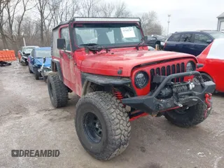 2002 Jeep Wrangler X with VIN 1J4FA39S52P708519, listed as a IAAI auction lot 41569747 with 219,168 mi miles. Bid and sale history available at carsss.com. Image 1.