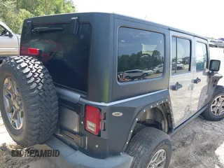 2016 Jeep Wrangler Unlimited Rubicon Hard Rock with VIN 1C4BJWFG6GL265320, listed as a IAAI auction lot 42260151 with Not provided miles and . Bid and sale history available at DreamBid. Image 4.