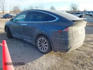 2017 Tesla Model X 90D with VIN 5YJXCDE23HF051321, listed as a IAAI auction lot 41415384 with 127,476 mi miles and . Bid and sale history available at carsss.com. Image 3.