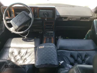 1991 Cadillac Seville z VIN 1G6KS53B9MU824142, wystawiony jako Copart lot #74276264 z przebiegiem 103 517 mil mil oraz Szkody całkowita. Historia ofert i sprzedaży dostępna na DreamBid. Obrazek 8.