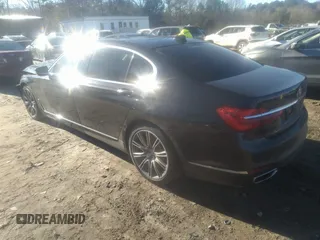 2018 BMW 7 Series 740i with VIN WBA7E2C57JG742257, listed as a IAAI auction lot 41353435 with 77,125 mi miles. Bid and sale history available at carsss.com. Image 3.