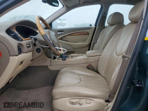 2002 Jaguar S-Type with VIN SAJDA01P12GM27242, listed as a Copart auction lot 88579215 with 218,546 mi miles and Salvage Title. Bid and sale history available at DreamBid. Image 7.