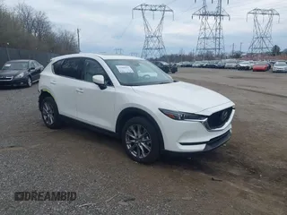 2020 Mazda CX-5 Grand Touring with VIN JM3KFBDM5L0731373, listed as a IAAI auction lot 41900567 with 31,268 mi miles and . Bid and sale history available at DreamBid. Image 1.
