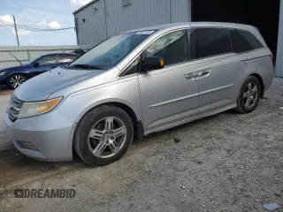 2011 Honda Odyssey Touring с VIN 5FNRL5H94BB004264, выставлен на аукционе Copart как лот 50827515 с пробегом 287 857 миль миль и Списание • Salvage title. История ставок и продаж доступна на DreamBid. Изображение 1.