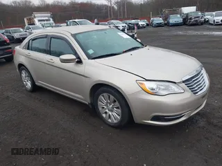 2014 Chrysler 200 LX with VIN 1C3CCBAB2EN213983, listed as a IAAI auction lot 42006774 with 80,615 mi miles and . Bid and sale history available at carsss.com. Image 1.