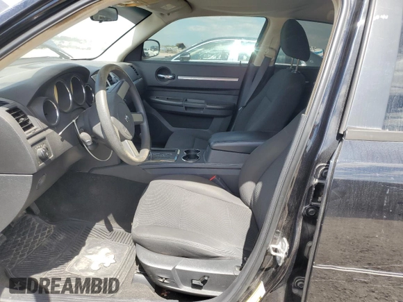 2009 Dodge Charger SXT with VIN 2B3KA33V09H503519, listed as a Copart auction lot 52825785 with 112,483 mi miles and Salvage Title. Bid and sale history available at carsss.com. Image 7.