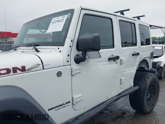 2014 Jeep Wrangler Unlimited Rubicon with VIN 1C4HJWFG4EL104827, listed as a IAAI auction lot 42236622 with 90,935 mi miles and . Bid and sale history available at DreamBid. Image 6.