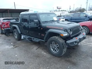 2024 Jeep Gladiator Mojave X z VIN 1C6JJTEG2RL124895, wystawiony jako IAAI lot #41304509 z przebiegiem 986 mil mil oraz . Historia ofert i sprzedaży dostępna na DreamBid. Obrazek 1.