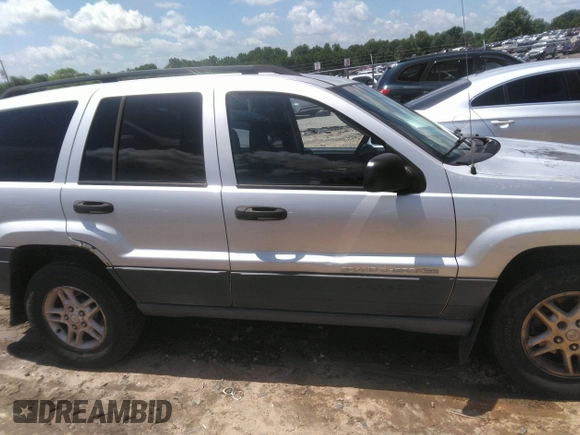 2004 Jeep Grand Cherokee Laredo z VIN 1J4GW48SX4C309998, wystawiony jako IAAI lot #42307167 z przebiegiem 306 912 mil mil oraz . Historia ofert i sprzedaży dostępna na DreamBid. Obrazek 13.