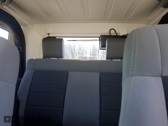 2010 Jeep Wrangler Sahara with VIN 1J4AA5D16AL203910, listed as a Copart auction lot 62891315 with 124,337 mi miles and Salvage title. Bid and sale history available at DreamBid. Image 10.