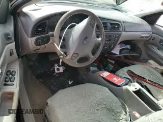 2000 Ford Taurus SE with VIN 1FAFP53U9YG285971, listed as a Copart auction lot 78138984 with 182,135 mi miles and Salvage Title. Bid and sale history available at DreamBid. Image 8.