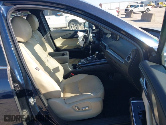 2016 Mazda CX-9 Grand Touring with VIN JM3TCADY6G0107064, listed as a IAAI auction lot 42580485 with 124,713 mi miles and . Bid and sale history available at DreamBid. Image 5.