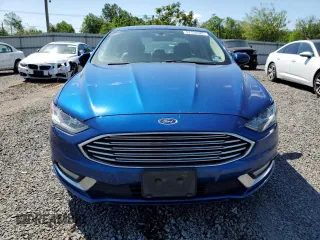 2017 Ford Fusion SE z VIN 3FA6P0T9XHR303675, wystawiony jako Copart lot #57134985 z przebiegiem 130 964 mil mil oraz Tytuł czysty. Historia ofert i sprzedaży dostępna na DreamBid. Obrazek 5.