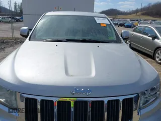 2013 Jeep Grand Cherokee Laredo with VIN 1C4RJFAG5DC634685, listed as a IAAI auction lot 41792147 with 260,594 mi miles. Bid and sale history available at carsss.com. Image 6.