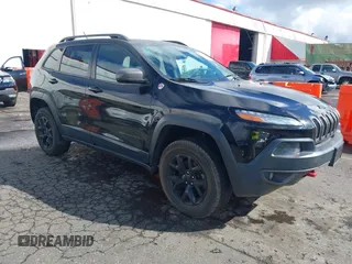2015 Jeep Cherokee Trailhawk with VIN 1C4PJMBS7FW699392, listed as a IAAI auction lot 41797617 with 1 mi miles. Bid and sale history available at carsss.com. Image 1.