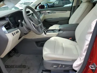 2023 Cadillac XT5 FWD Premium Luxury z VIN 1GYKNCRS5PZ173528, wystawiony jako Copart lot #55805605 z przebiegiem 7 789 mil mil oraz Szkoda całkowita • Salvage title. Historia ofert i sprzedaży dostępna na DreamBid. Obrazek 7.