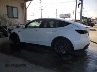 2022 Tesla Model Y Performance with VIN 7SAYGDEF8NF381644, listed as a Copart auction lot 44554585 with 71,413 mi miles and Salvage Title. Bid and sale history available at DreamBid. Image 2.