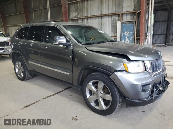 2013 Jeep Grand Cherokee Overland with VIN 1C4RJECT6DC526032, listed as a Copart auction lot 55660905 with 97,406 mi miles and Salvage Title. Bid and sale history available at DreamBid. Image 4.