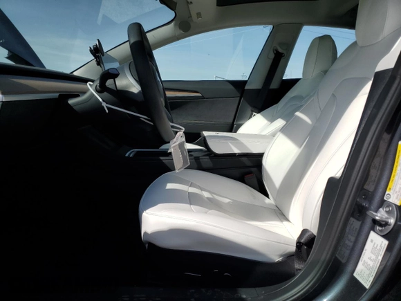 2023 Tesla Model 3 with VIN 5YJ3E1EA8PF648073, listed as a Copart auction lot 49284775 with 20,498 mi miles and Salvage Title. Bid and sale history available at DreamBid. Image 7.