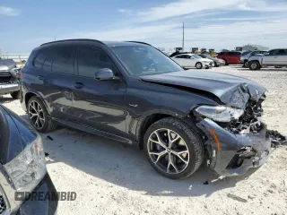 2022 BMW X5 xDrive45e with VIN 5UXTA6C0XN9M79182, listed as a Copart auction lot 48599195 with 31,219 mi miles and Salvage Title. Bid and sale history available at carsss.com. Image 4.