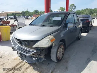 2010 Nissan Versa 1.8 S with VIN 3N1BC1AP0AL365397, listed as a IAAI auction lot 41987852 with 183,952 mi miles. Bid and sale history available at carsss.com. Image 2.