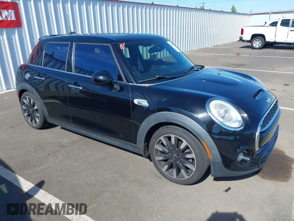 2015 MINI Hardtop 4 Door S z VIN WMWXU3C58F2B57218, wystawiony jako IAAI lot #42361437 z przebiegiem 96 984 mil mil oraz . Historia ofert i sprzedaży dostępna na DreamBid. Obrazek 1.
