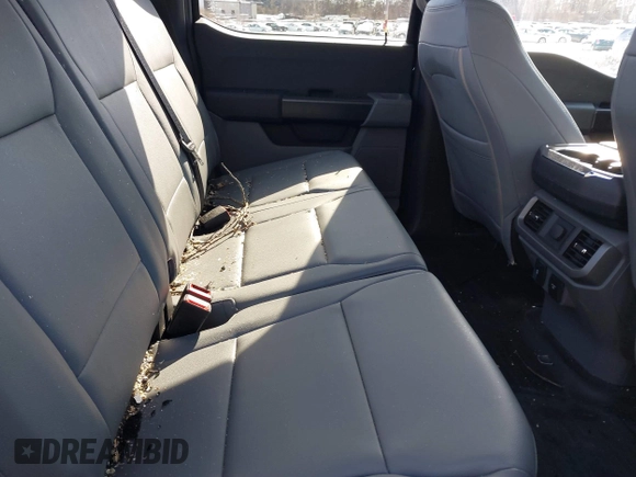 2023 Ford F-150 Lightning Pro with VIN 1FTVW1EL7PWG07081, listed as a IAAI auction lot 38702102 with 9,976 mi miles and . Bid and sale history available at DreamBid. Image 8.
