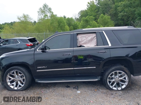 2016 GMC Yukon Denali with VIN 1GKS1CKJXGR254306, listed as a IAAI auction lot 39953539 with 164,149 mi miles. Bid and sale history available at carsss.com. Image 14.