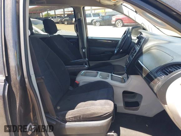 2014 Dodge Grand Caravan SXT with VIN 2C4RDGCG7ER265931, listed as a IAAI auction lot 42141644 with 205,968 mi miles and . Bid and sale history available at DreamBid. Image 5.
